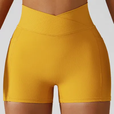 Pantaloncini da yoga da corsa sportivi da corsa per sport di sollevamento del sedere da palestra a vita alta da ragazza in tessuto elasticizzato a costine con tasche